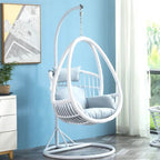 Tropical porch swing with corrosion-resistant cushions, alloy chain, and sturdy stand included