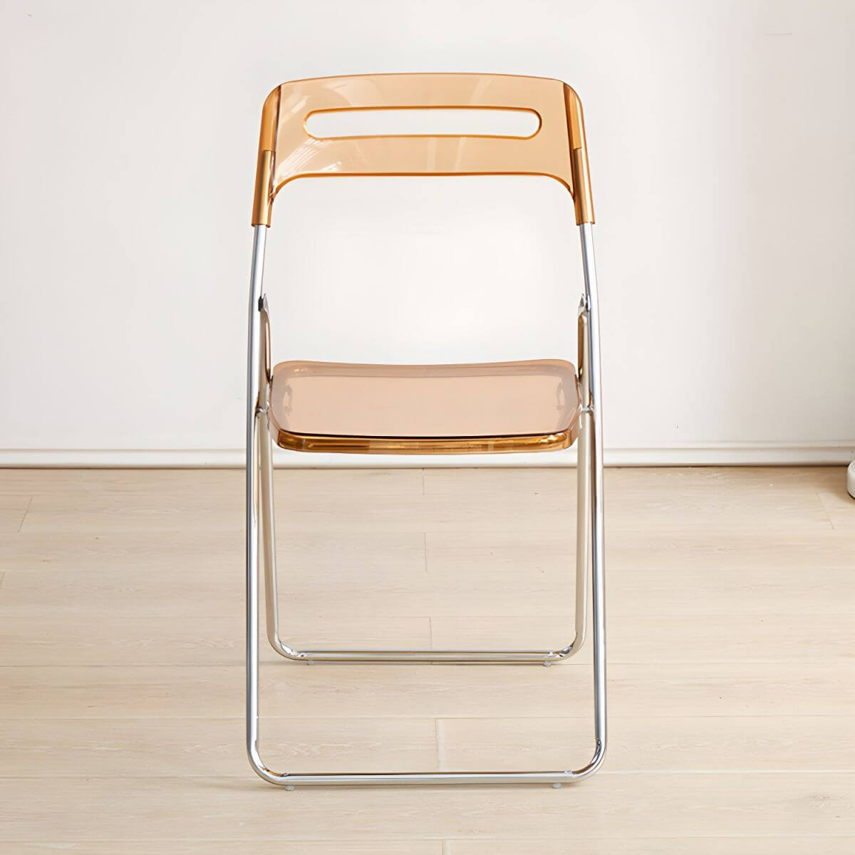 Modern collapsible open back side chair made of plastic and acrylic, ideal for kitchen and dining areas