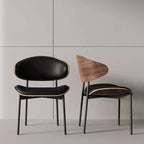 Black leather single dining chair with curved back, durable and minimalist luxury design