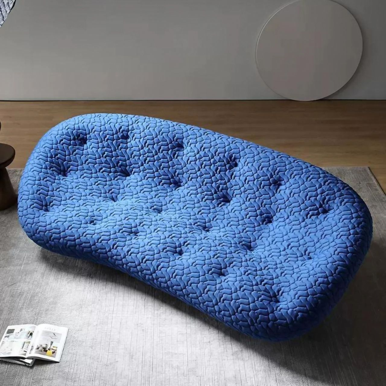 Blue minimalist shell sofa with 5D spacer fabric in a modern living room setting