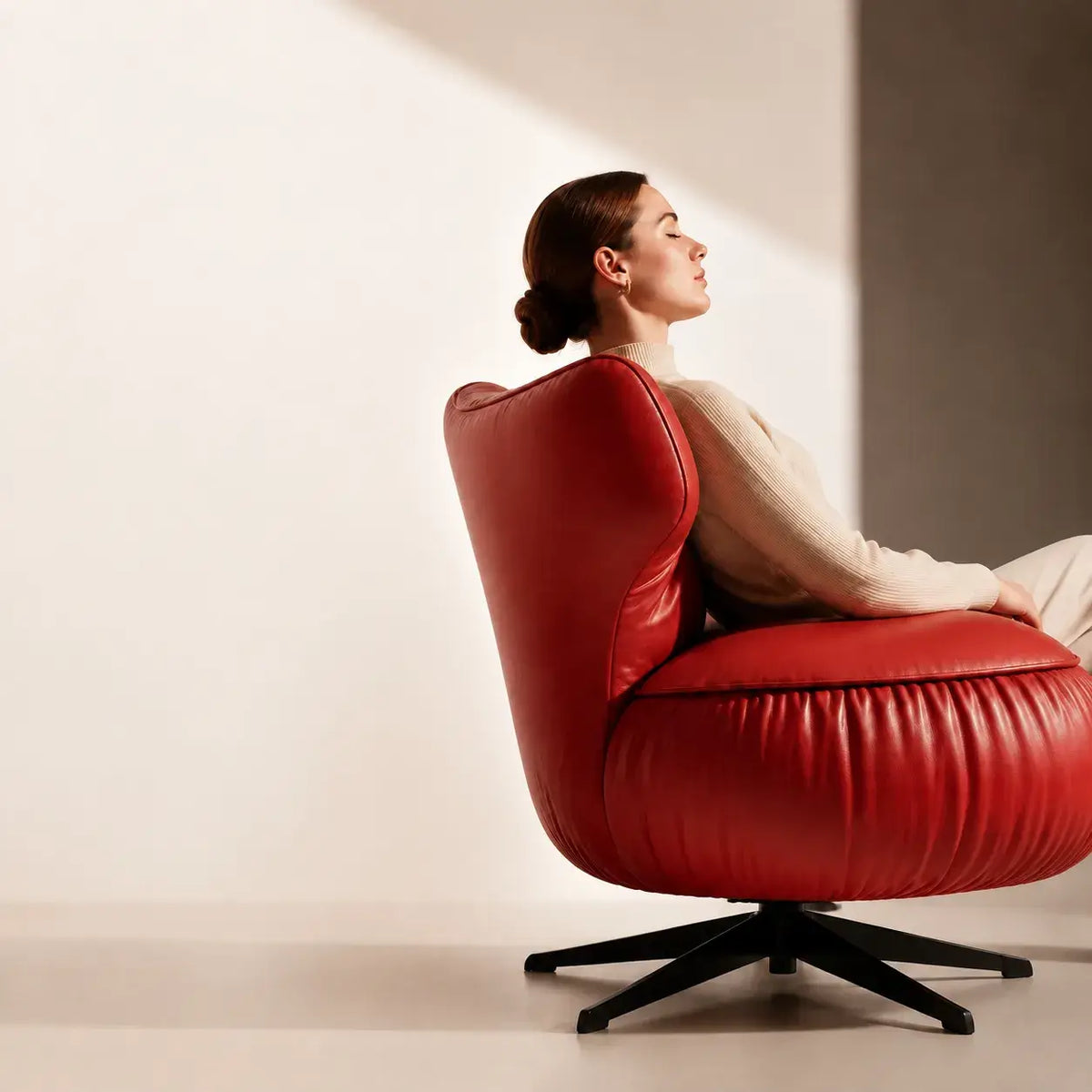 Burgundy Leather Lounge Chair with Sculpted Wing Back and Swivel Base