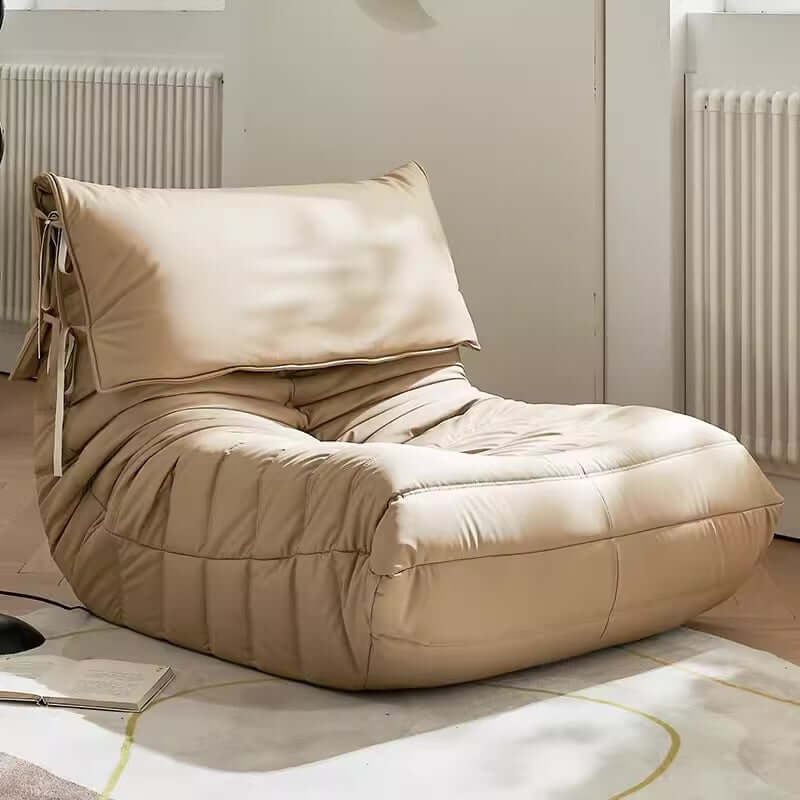 Burnt orange single lounge chair in PU leather with caterpillar design, Togo sofa style