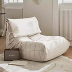 Burnt orange single lounge chair in PU leather with caterpillar design, Togo sofa style