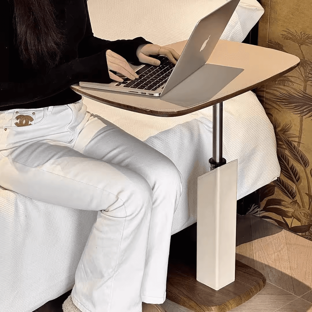 Movable end table in classic beige saddle leather, perfect for cozy living spaces