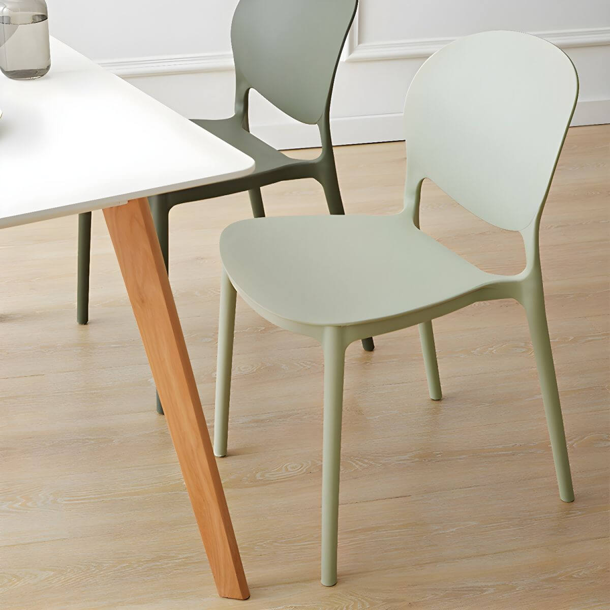 Scandinavian plastic dining chair with open back and four legs, ideal for home use main product image Main image