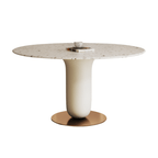 Round terrazzo dining table featuring a stylish wooden and metal base for elegant interiors