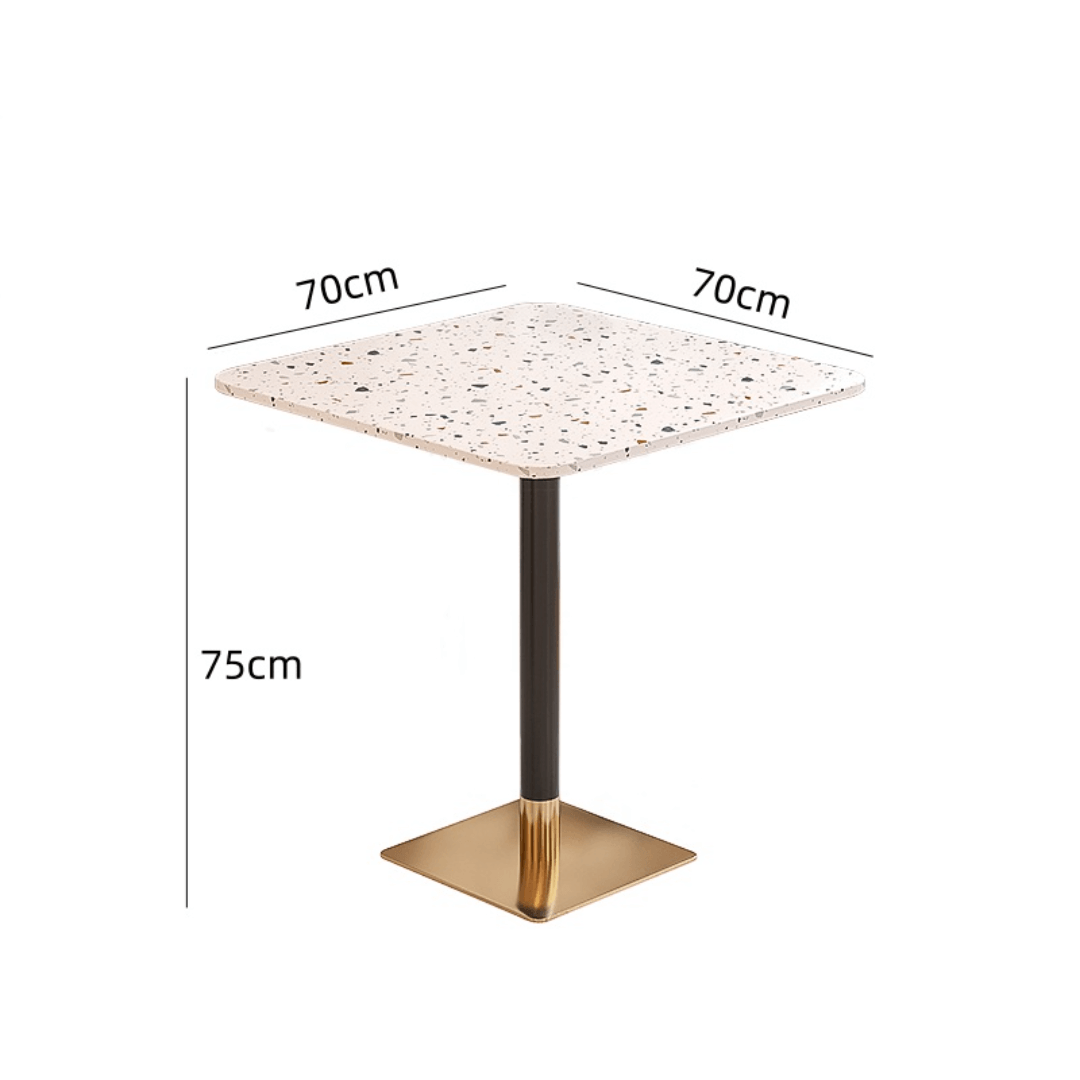 Rattan dining chairs with durable terrazzo table for an elegant dining setup