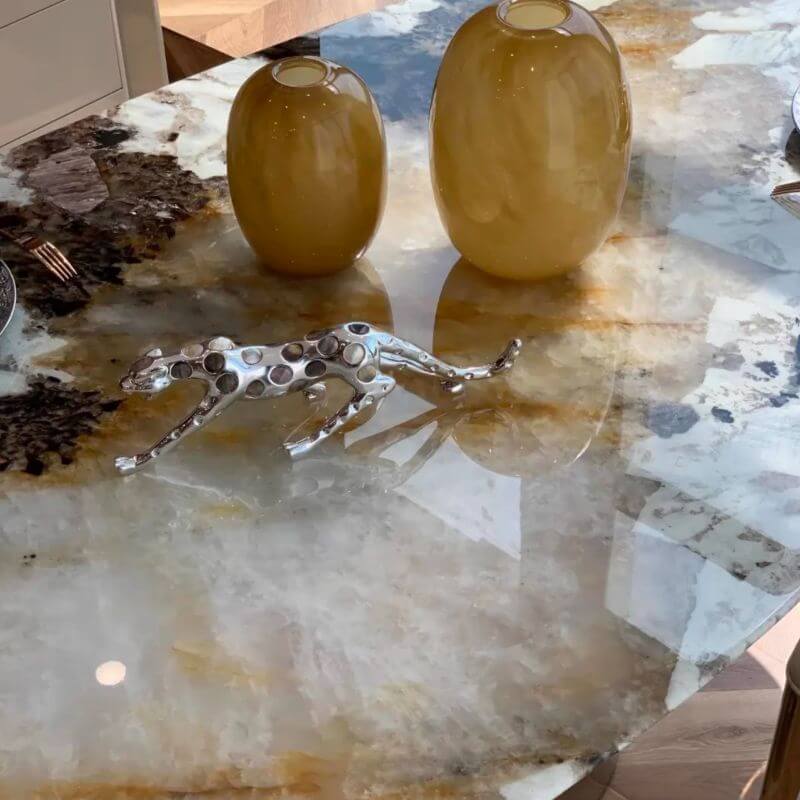 Elliptical white marble effect dining table with anti-stain and scratch-tolerant finish, seats 6 to 8