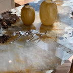 Elliptical white marble effect dining table with anti-stain and scratch-tolerant finish, seats 6 to 8