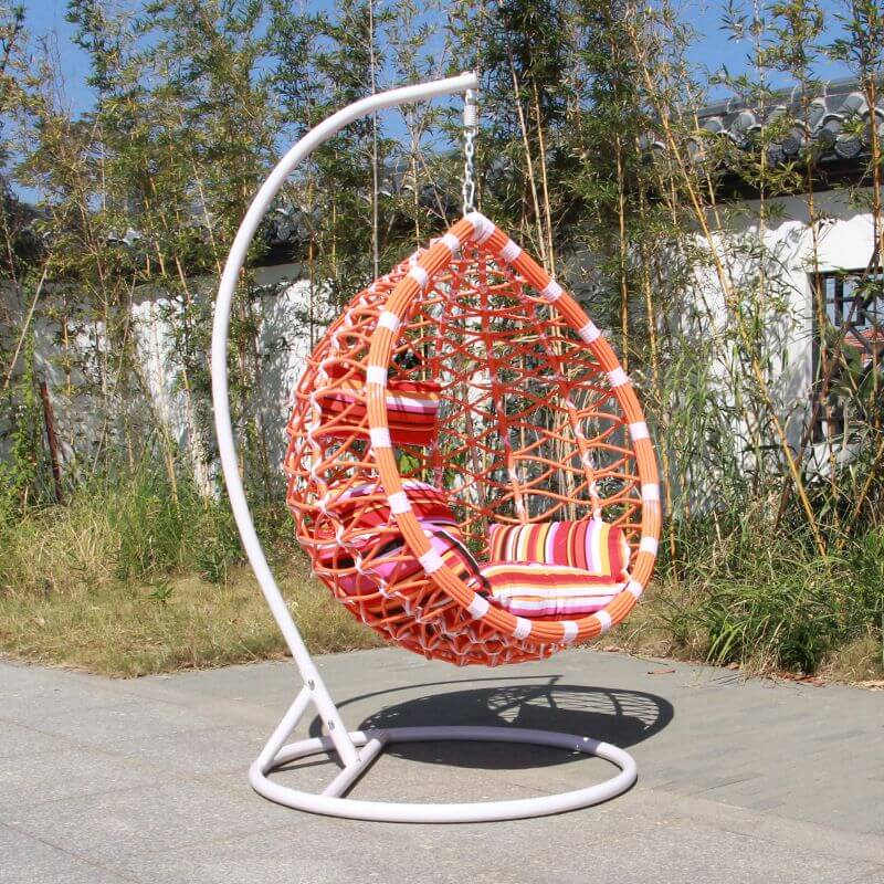 Metal porch swing with stand, cushions, and chain for comfortable outdoor seating