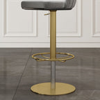 Gray velvet swivel bar stool with curved back and adjustable height, perfect for kitchen or bar seating
