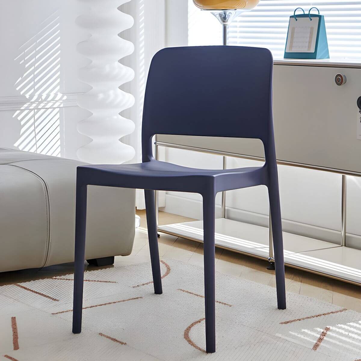 Scandinavian plastic and acrylic dining chair with low backrest and armless design