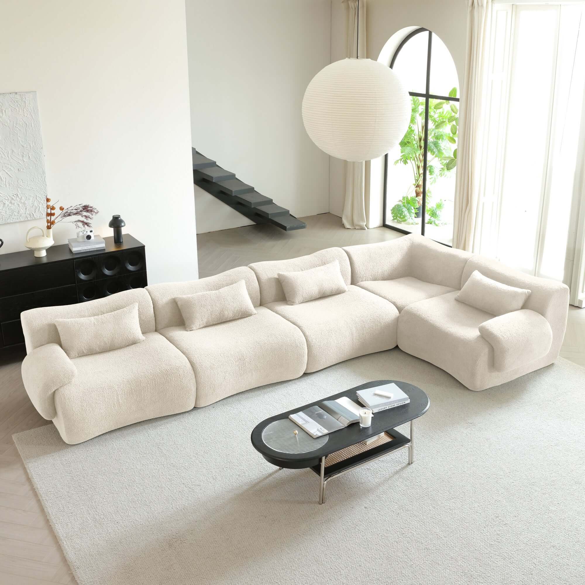 Modern sectional sofa upholstered in soft teddy velvet fabric with modular design