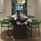 Modern oval black marble dining table with double pedestal base for stylish dining rooms