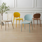 Scandinavian plastic dining chair with open back and four legs, ideal for home use