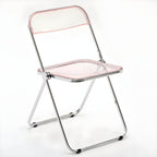 Scandinavian style dining chair with silver metal legs and plastic acrylic seat