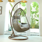 Metal porch swing with tropical olive green, auburn, and rose cushions, includes stand and chain