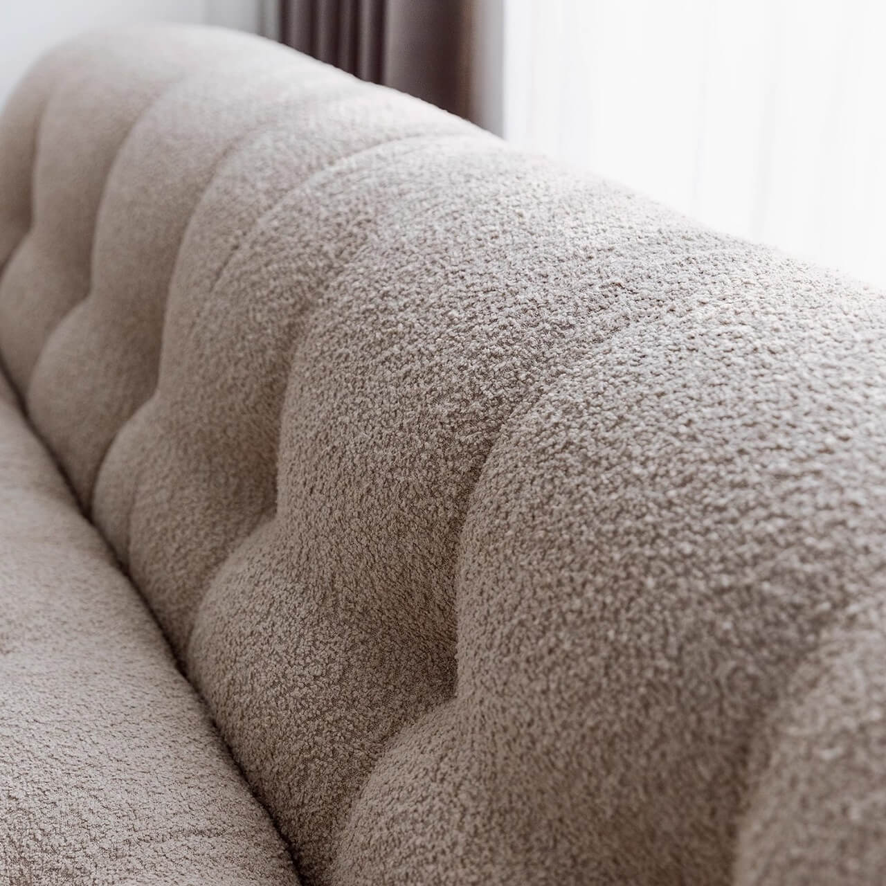 Beige boucle armless sofa with stainless steel frame, stylish and modern design