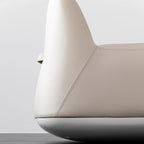 White microfiber leather tumbler sofa with a chic, cute armless design for modern living rooms