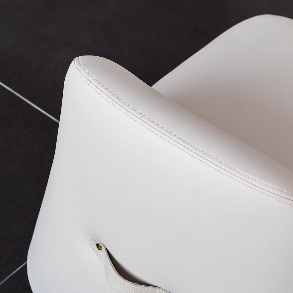 White microfiber leather tumbler sofa with a chic, cute armless design for modern living rooms