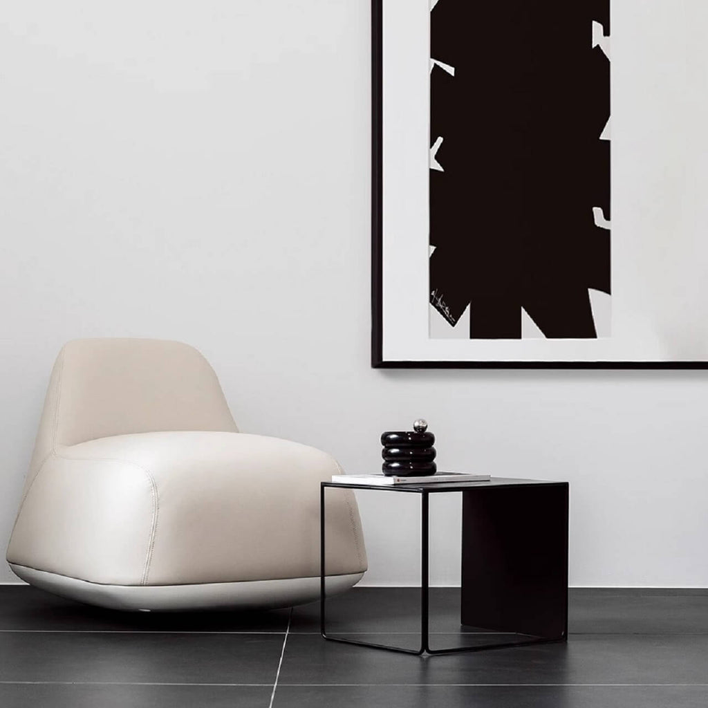 White microfiber leather tumbler sofa with a chic, cute armless design for modern living rooms