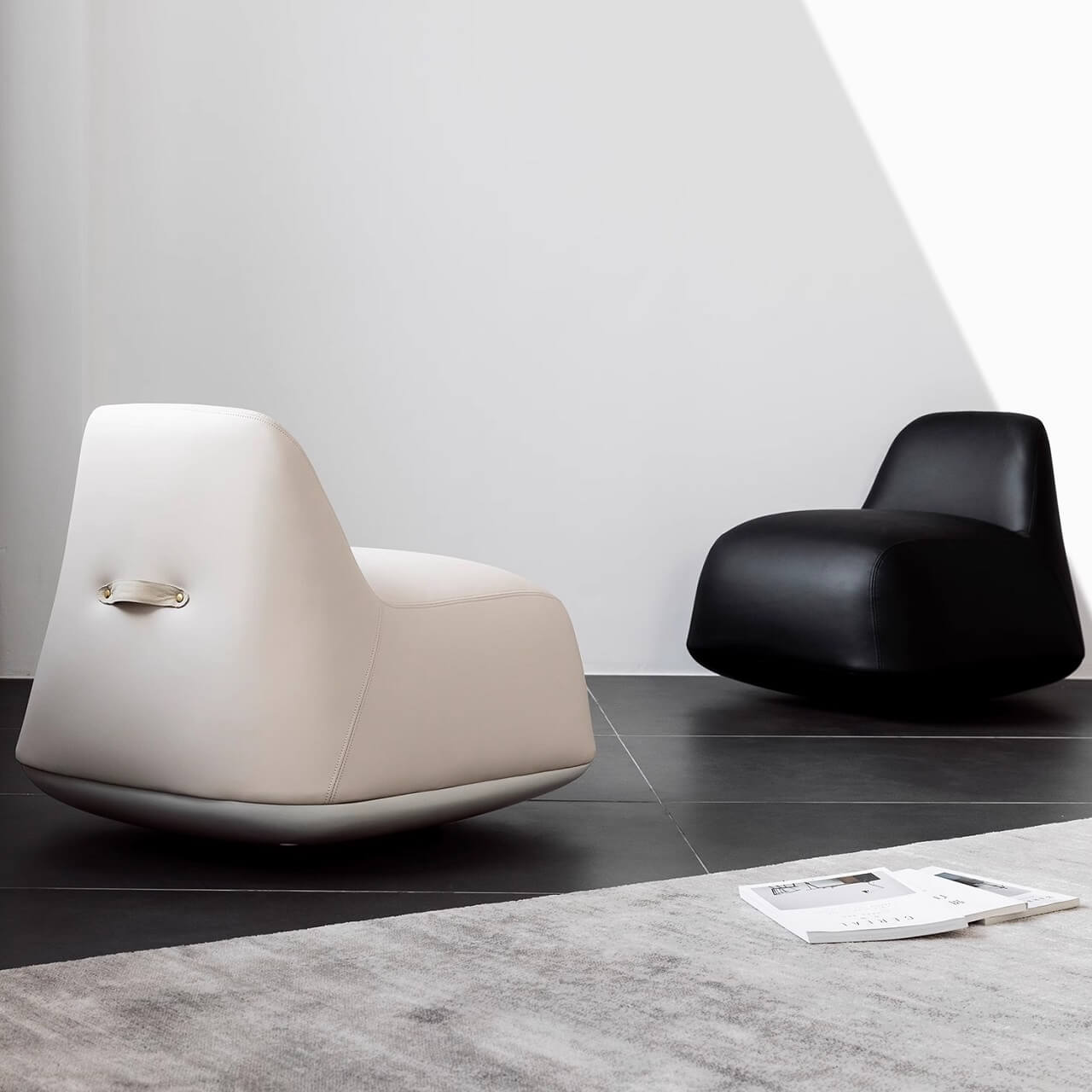 White microfiber leather tumbler sofa with a chic, cute armless design for modern living rooms