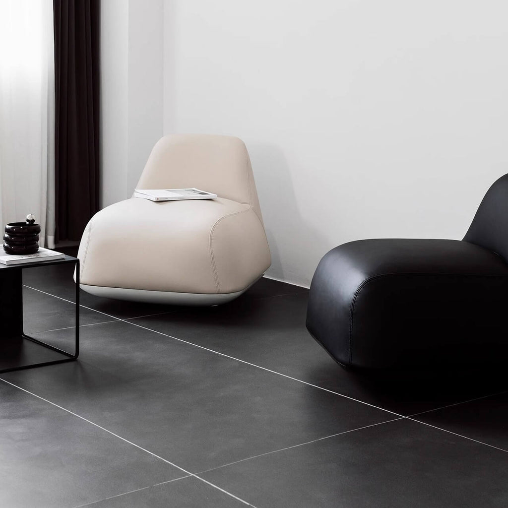 White microfiber leather tumbler sofa with a chic, cute armless design for modern living rooms