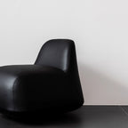 White microfiber leather tumbler sofa with a chic, cute armless design for modern living rooms