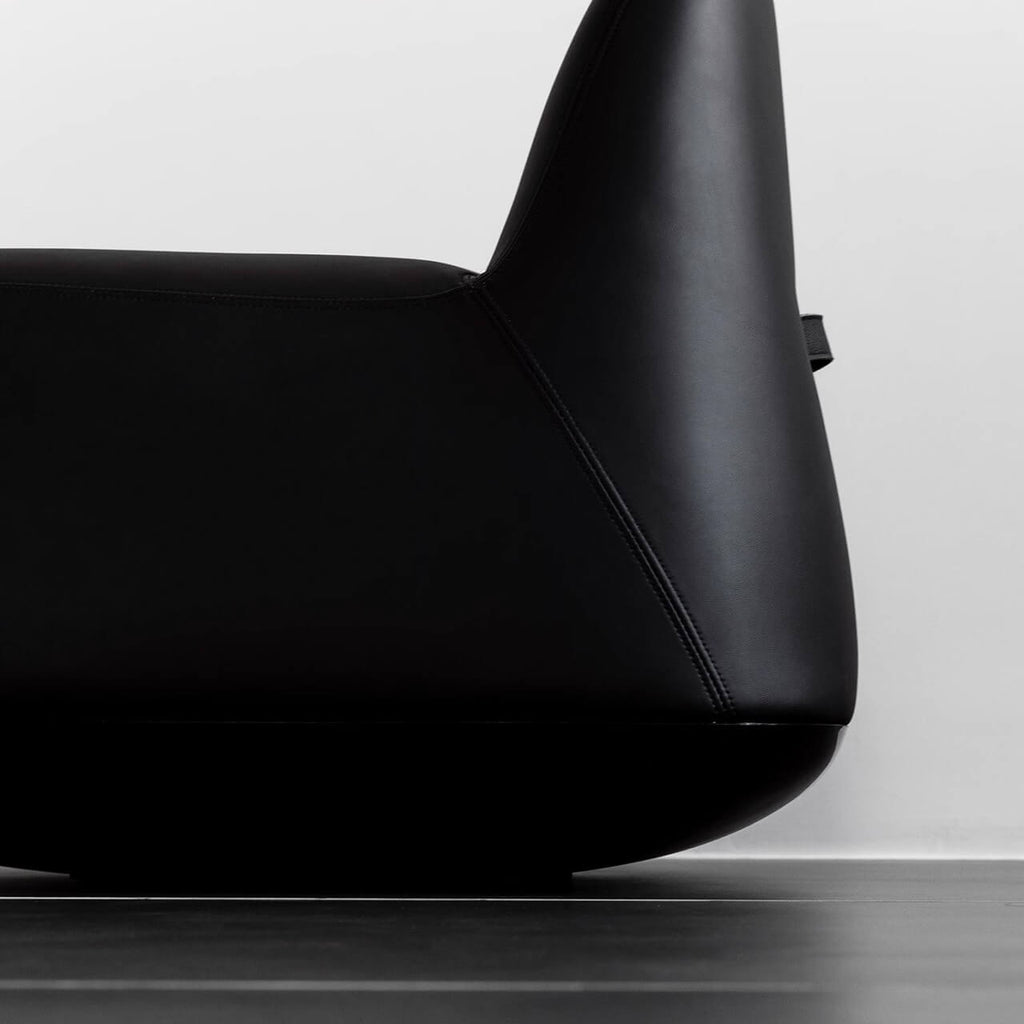 White microfiber leather tumbler sofa with a chic, cute armless design for modern living rooms