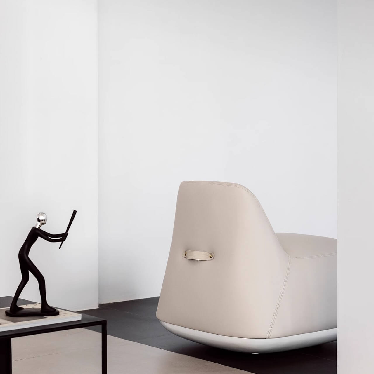 White microfiber leather tumbler sofa with a chic, cute armless design for modern living rooms