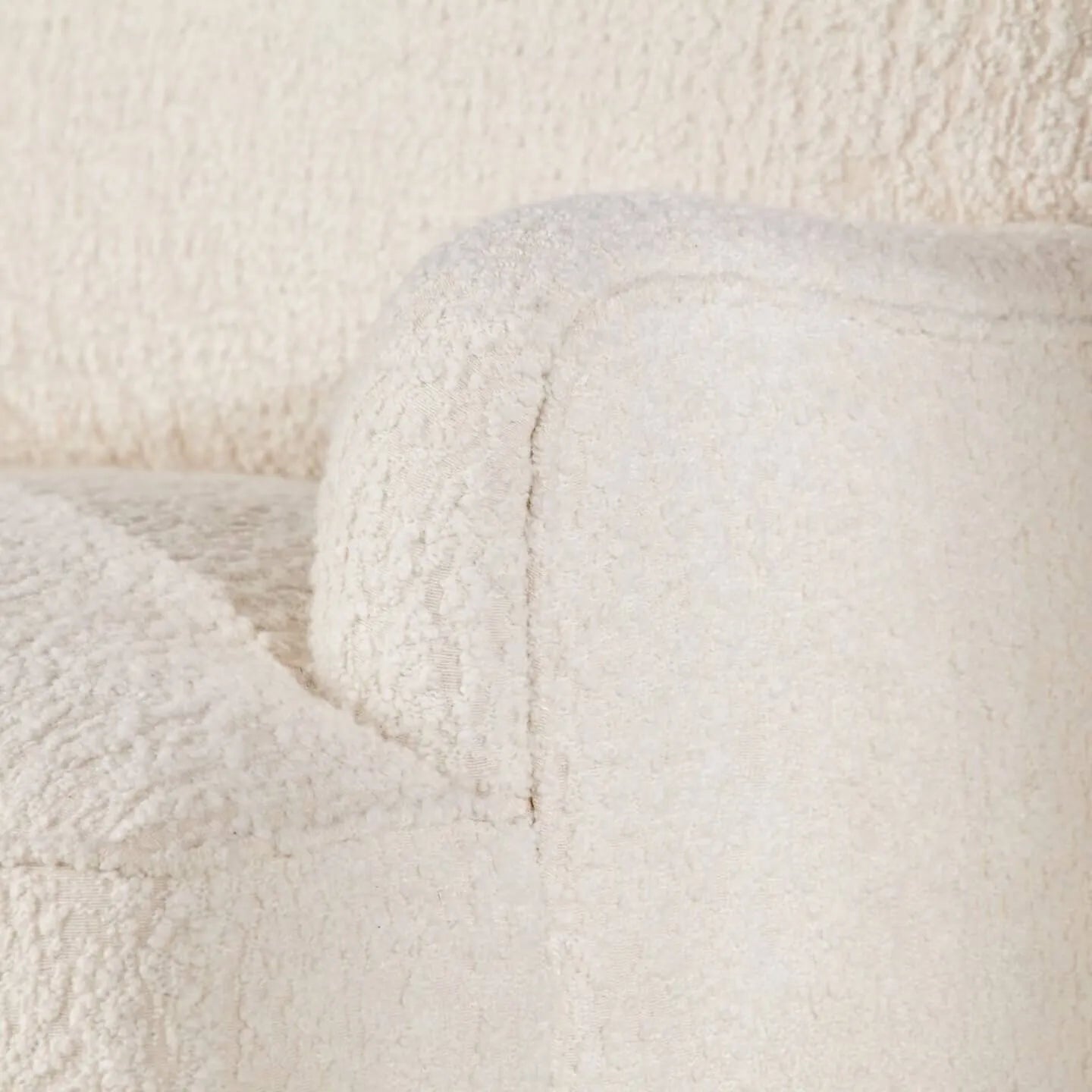 Cream Boucle Fringe Chair with Sculpted Arms for Boutique Corners