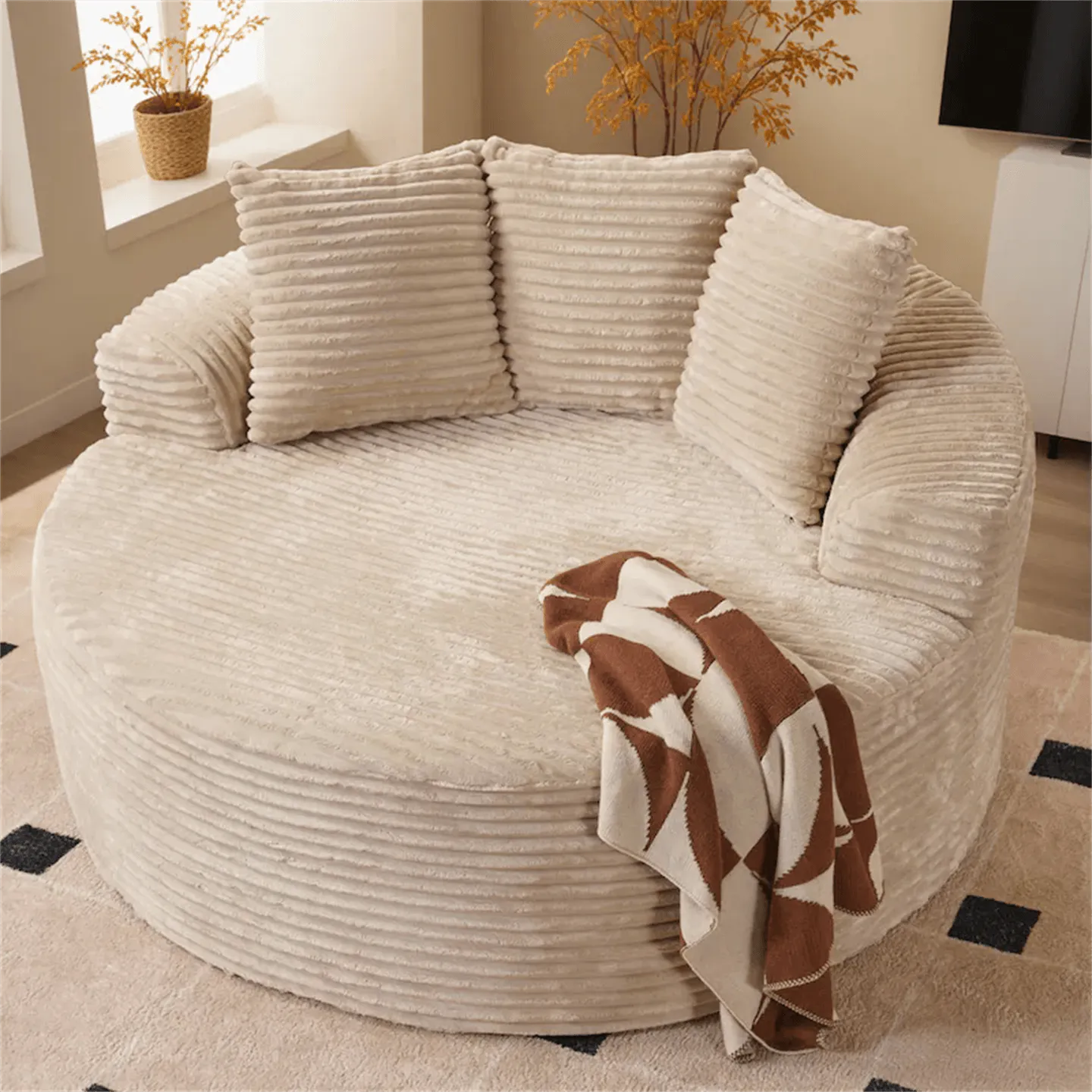 Cream Corduroy Round Sofa with Enveloping Curves for Cozy Lounging