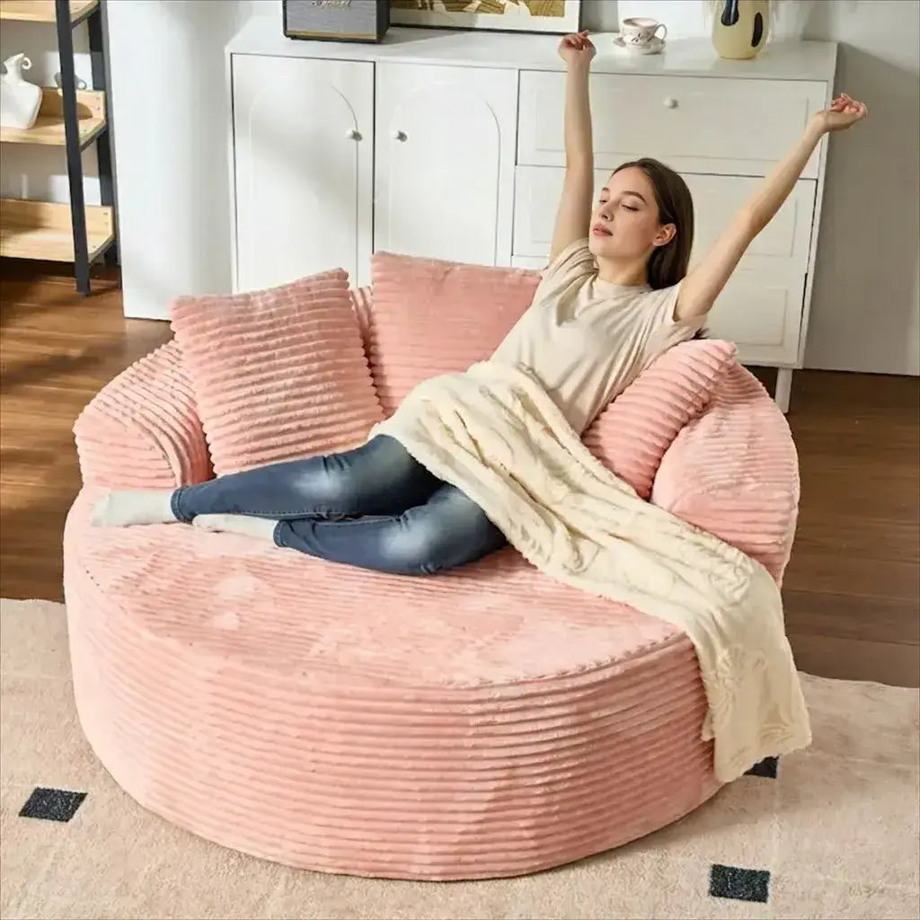 Cream Corduroy Round Sofa with Enveloping Curves for Cozy Lounging