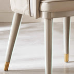 Curved Arm Leather Dining Chair Series with Lacquered Legs and Tailored Trim