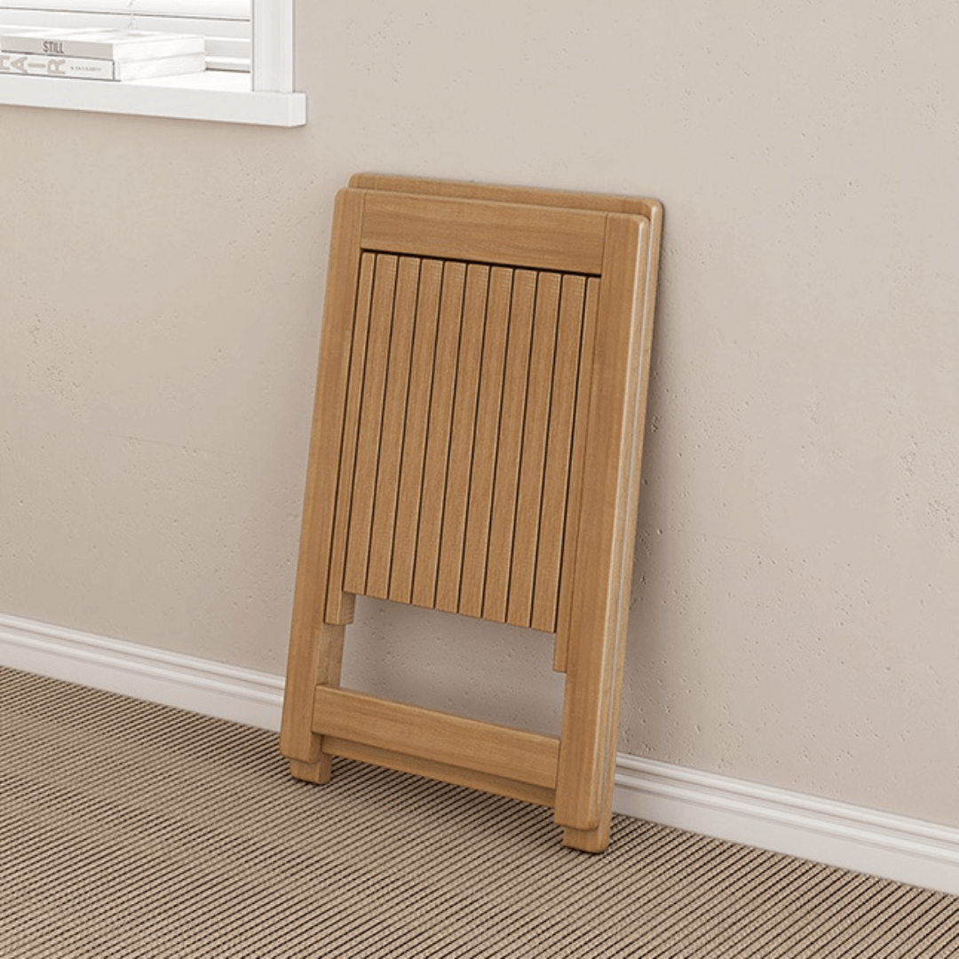 Round folding dining table with marble texture, perfect for small homes and space-saving design