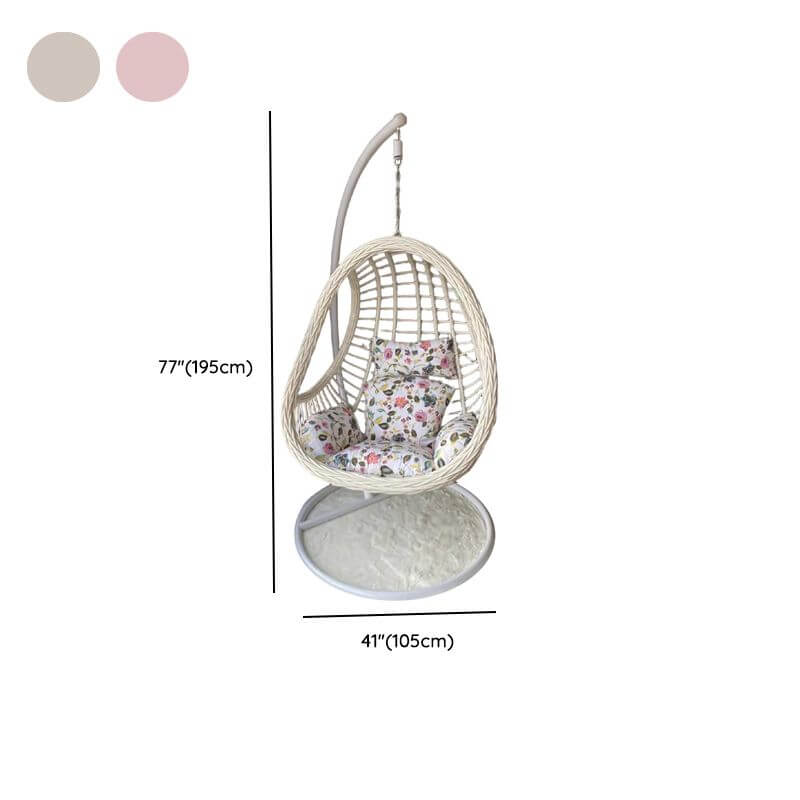 Tropical upholstered porch swing with metal chain and included stand for outdoor relaxation