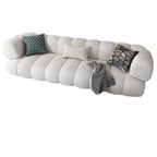 White Scandinavian fabric sofa with biscuit back and tuxedo arms