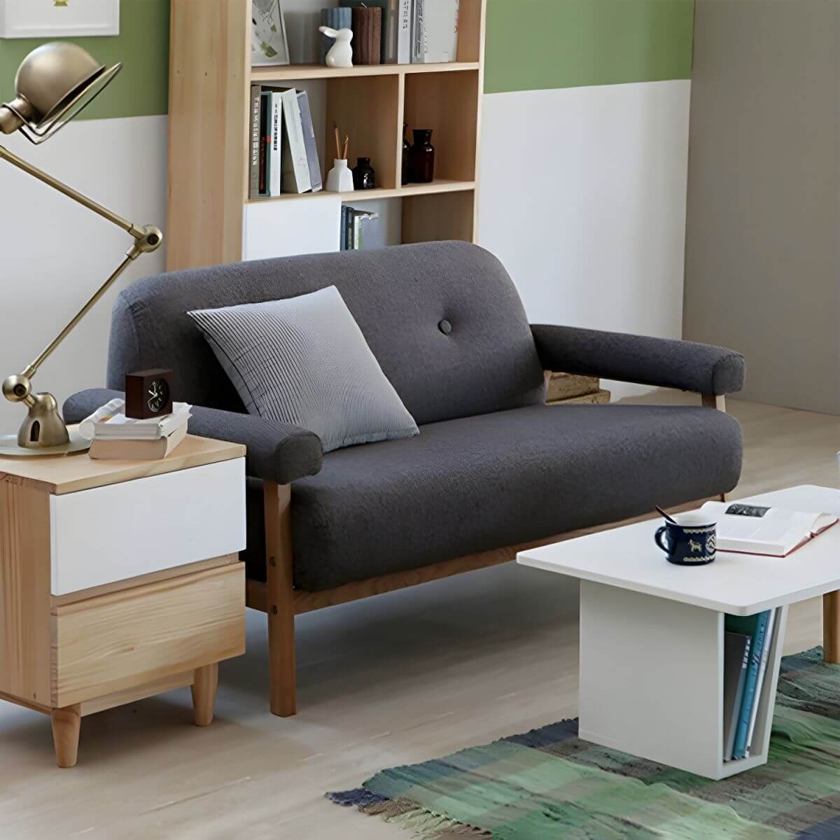 Black Scandinavian style small sofa with wood frame and faux leather upholstery