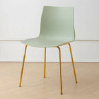 Modern plastic and acrylic side chair with metal legs, ideal for kitchen and dining rooms
