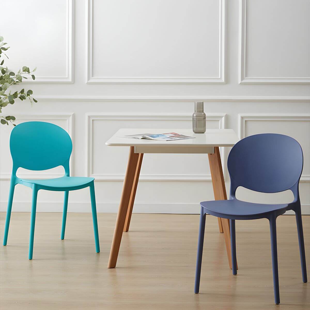 Scandinavian plastic dining chair with open back and four legs, ideal for home use