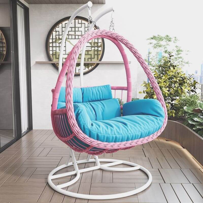 Tropical porch swing with corrosion-resistant cushions, alloy chain, and sturdy stand included
