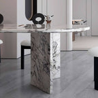 Oval dining table with white marble top and fixed base, perfect for contemporary dining rooms