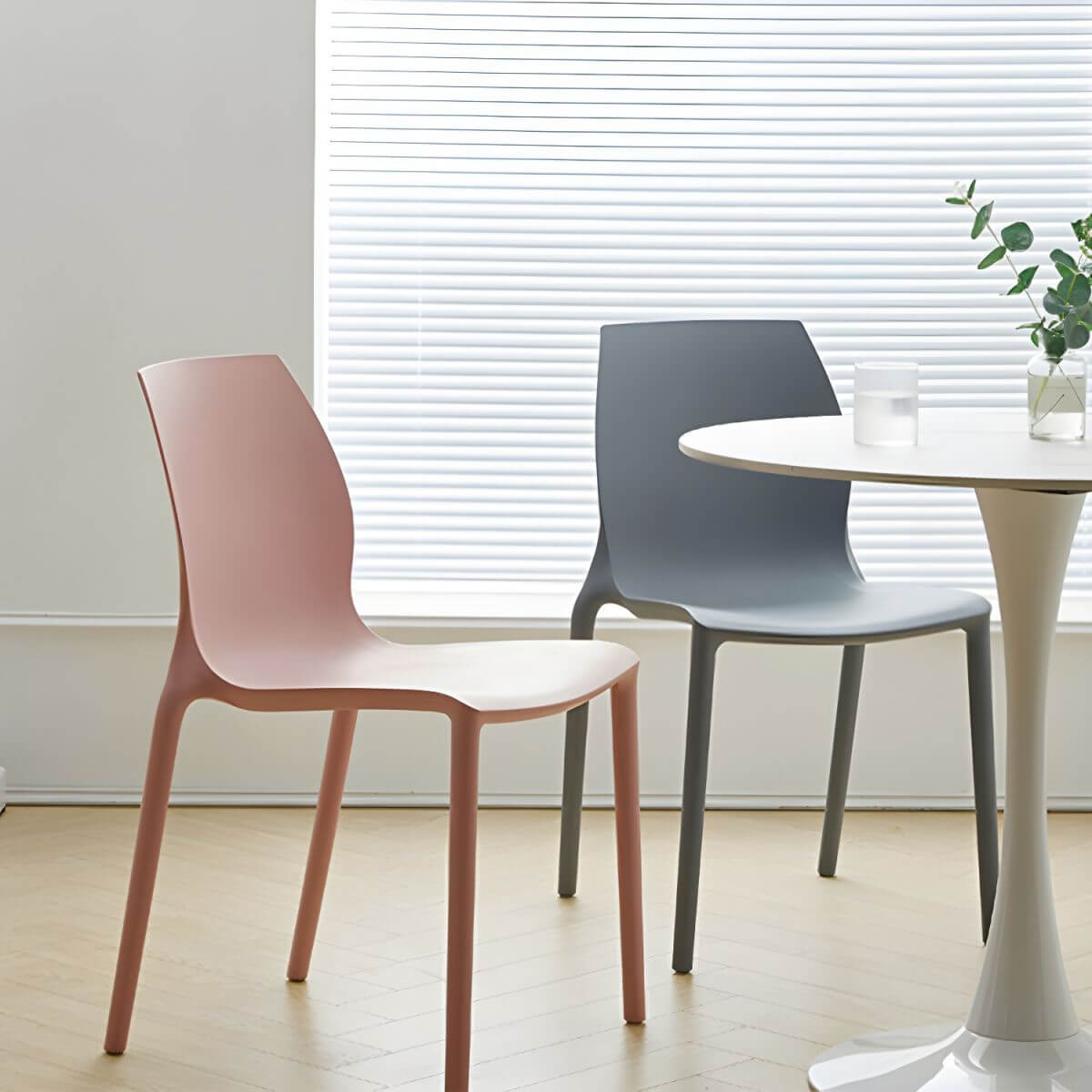 Stackable modern Scandinavian plastic and acrylic chair for kitchen and dining use