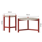 Round side table with vibrant red terrazzo top, featuring a modern minimalist design