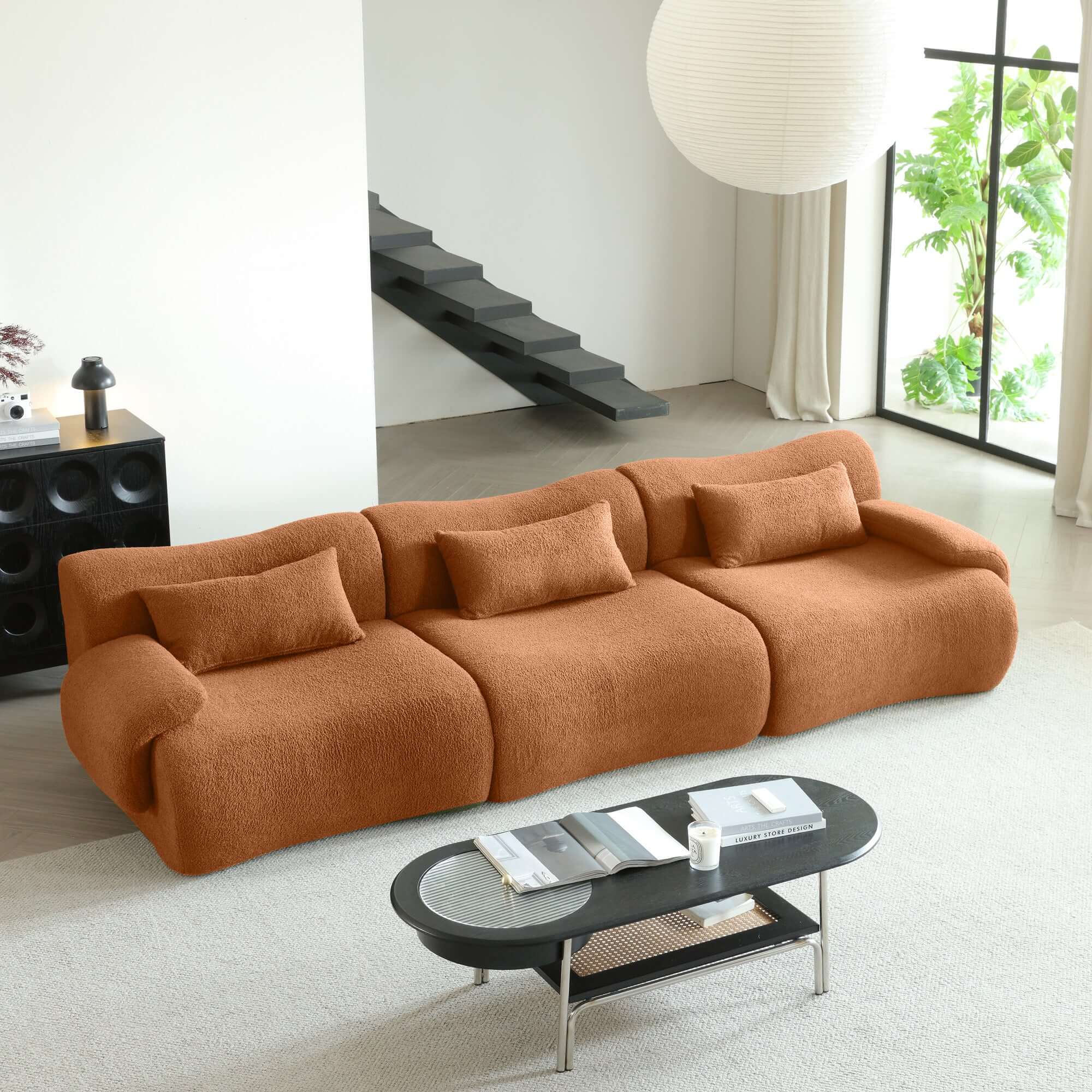 Modern sectional sofa upholstered in soft teddy velvet fabric with modular design