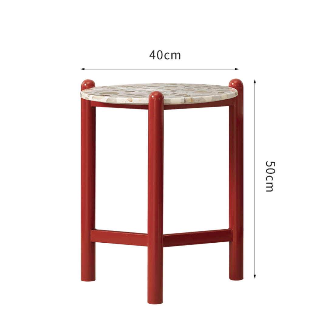 Round side table with vibrant red terrazzo top, featuring a modern minimalist design