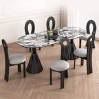 Oval marble dining table set with dual footing, solid back panel, and cushioned chairs