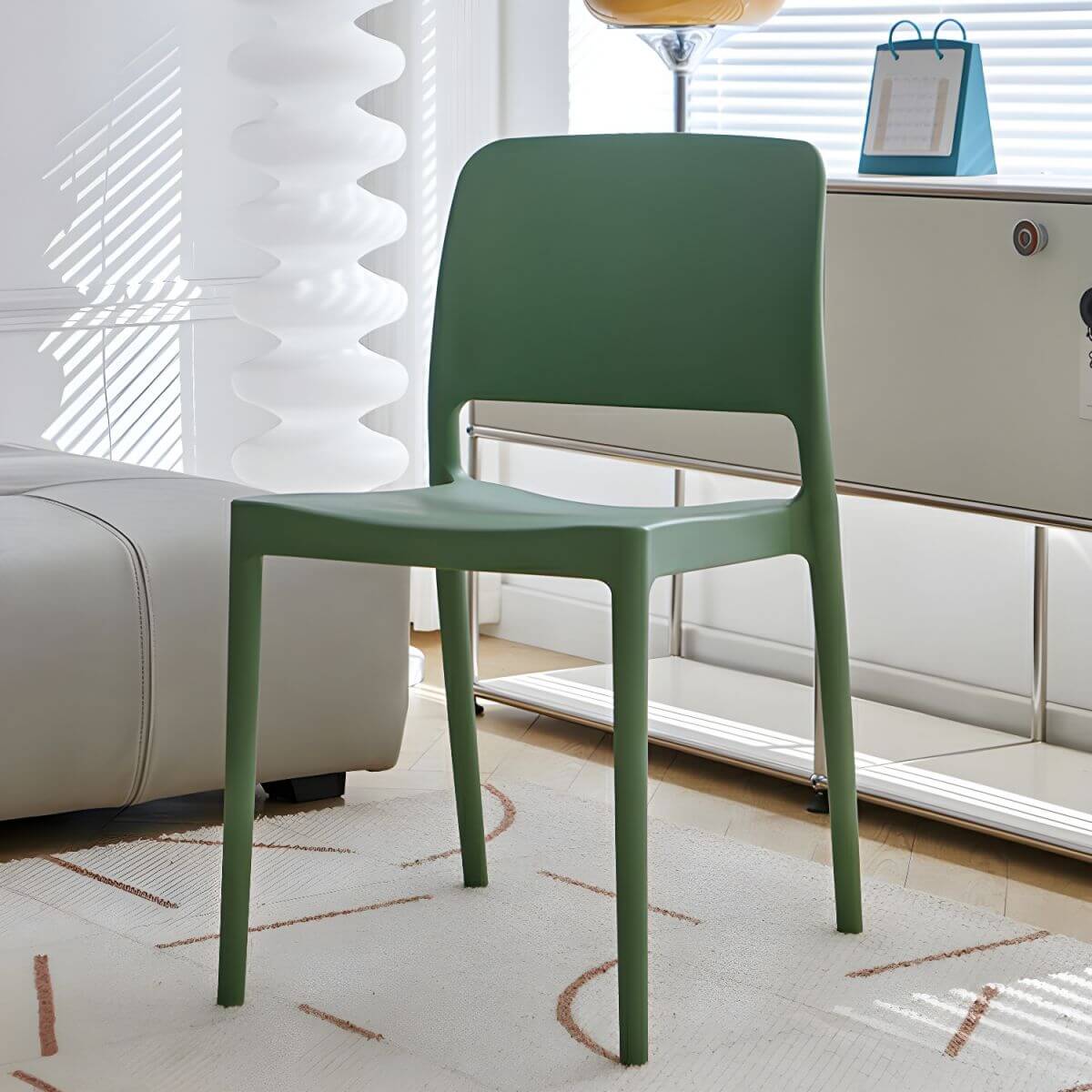 Scandinavian plastic and acrylic dining chair with low backrest and armless design