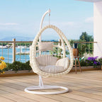 Pink metal 2-seater porch swing with stand, chain, and cushions for outdoor seating