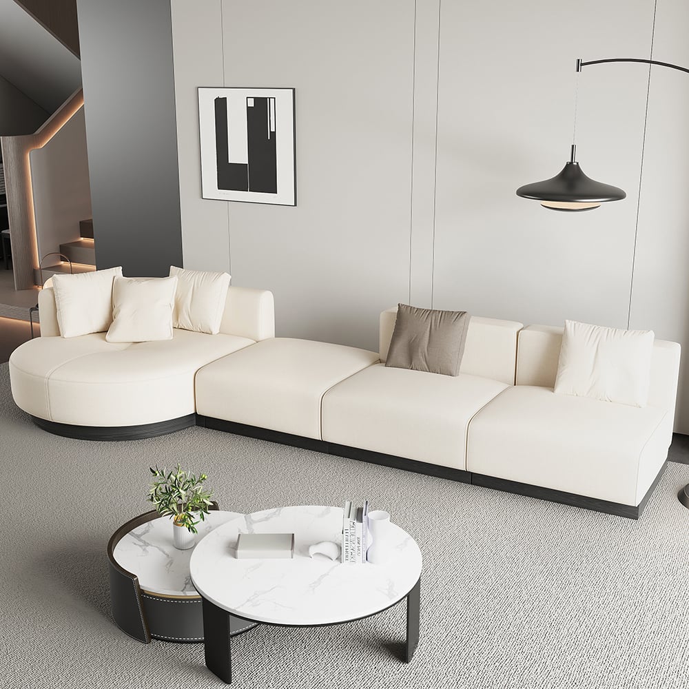 Beige modern L-shaped sectional sofa with pillows and black legs, perfect for corner seating